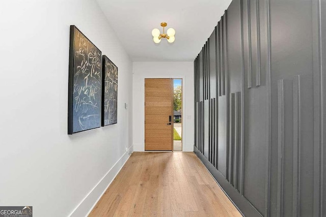 1598 Athens Ave SW, Atlanta, GA 30310 - hallway with light wood-style floors and a chandelier