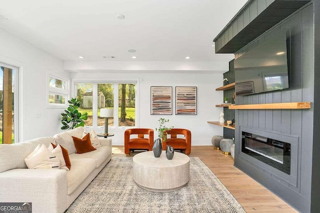 1598 Athens Ave SW, Atlanta, GA 30310 - living area with a glass covered fireplace, light wood-style flooring, and recessed lighting