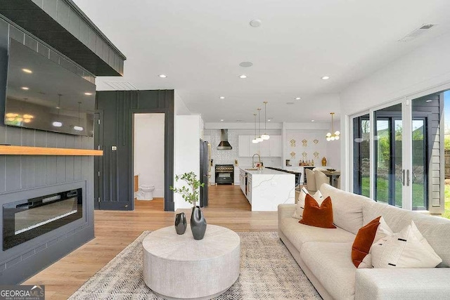1598 Athens Ave SW, Atlanta, GA 30310 - living area with light wood-type flooring, a fireplace, and recessed lighting