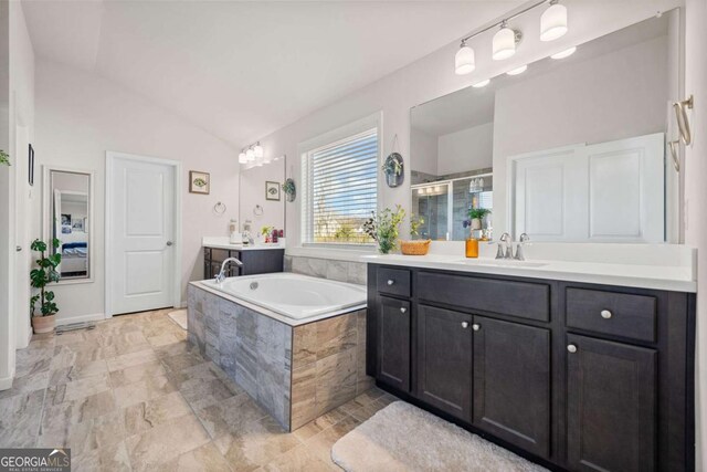 127 Crest Brooke Dr, Canton, GA 30115 - bathroom with a shower stall, two vanities, a sink, a garden tub, and vaulted ceiling
