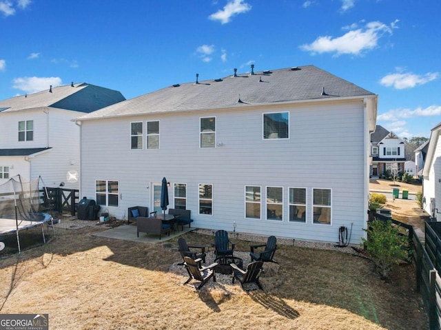 127 Crest Brooke Dr, Canton, GA 30115 - back of property featuring an outdoor fire pit, a patio area, and a trampoline