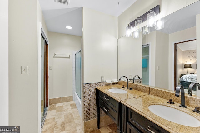 5429 Golfcrest Cir, Stone Mountain, GA 30088 - ensuite bathroom with double vanity, a sink, a shower with door, and ensuite bath