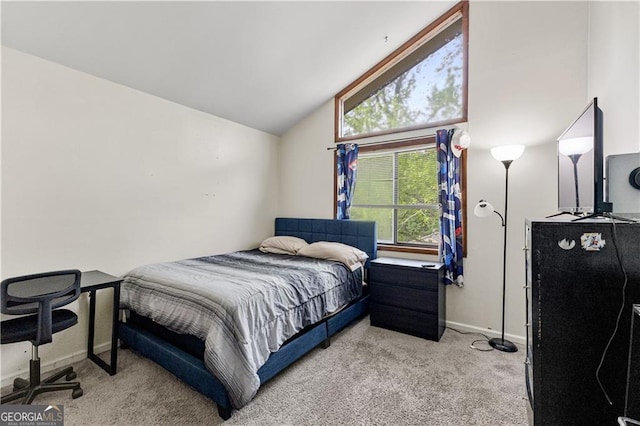 5429 Golfcrest Cir, Stone Mountain, GA 30088 - carpeted bedroom featuring baseboards and vaulted ceiling