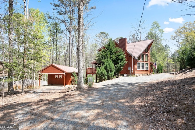 1466 Newport Dr, Ellijay, GA 30540 - view of side of home featuring dirt driveway and a metal roof