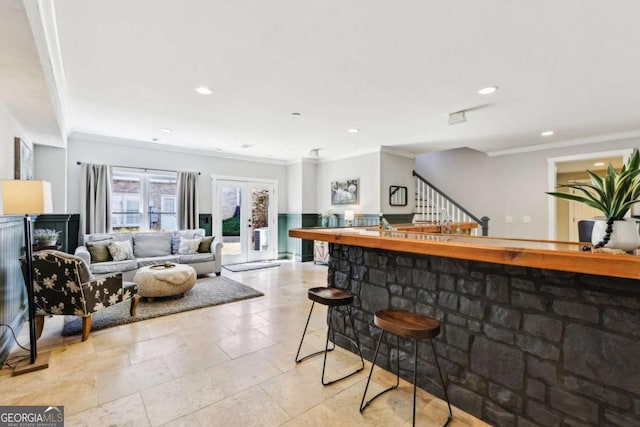 interior space with ornamental molding, stairs, and recessed lighting