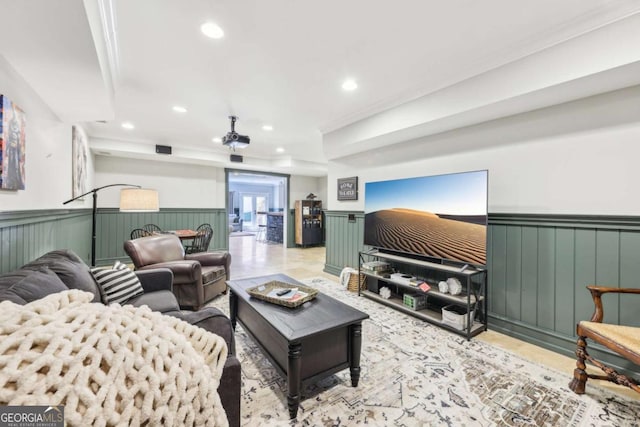 living area with recessed lighting and wainscoting