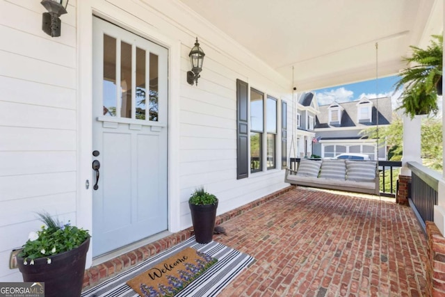 entrance to property featuring a porch