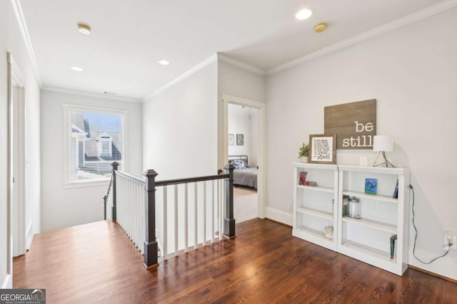 hall featuring recessed lighting, wood finished floors, an upstairs landing, and ornamental molding
