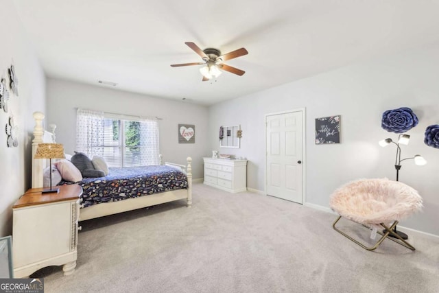 bedroom with baseboards, visible vents, carpet, and a ceiling fan