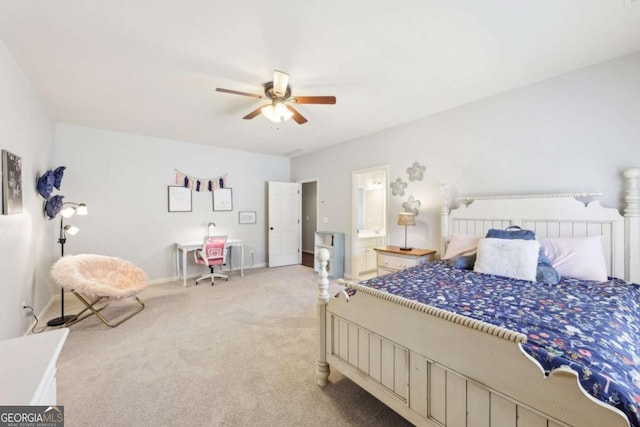bedroom with a ceiling fan, carpet, ensuite bath, and baseboards