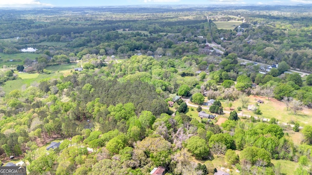 aerial view featuring a wooded view