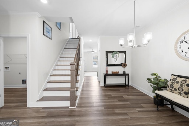 stairs featuring baseboards, crown molding, a chandelier, and wood finished floors