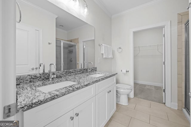 bathroom featuring a spacious closet, a sink, and a shower stall