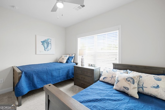 bedroom featuring carpet floors, visible vents, baseboards, and ceiling fan