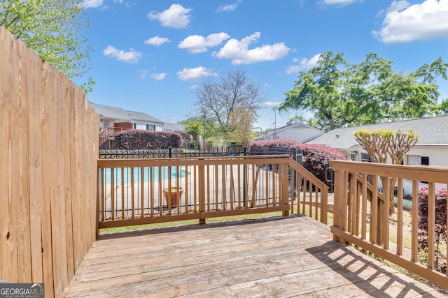 deck with a fenced backyard