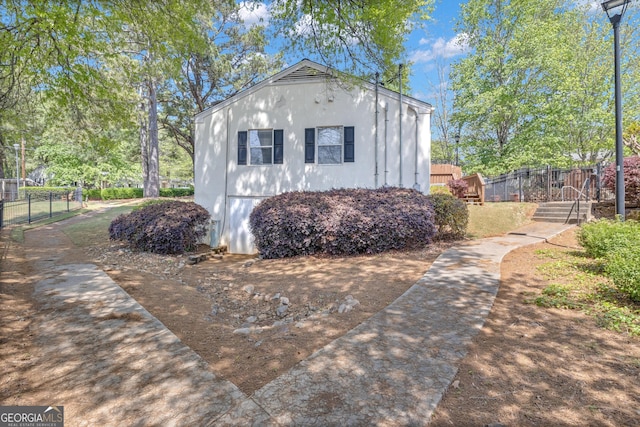 view of outdoor structure with fence