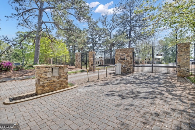 view of gate with fence