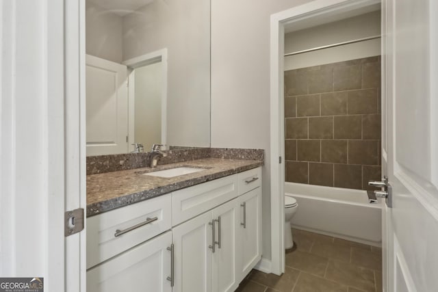 828 Canterbury Overlook NE, Atlanta, GA 30324 - full bathroom with toilet, vanity, tile patterned floors, and  shower combination