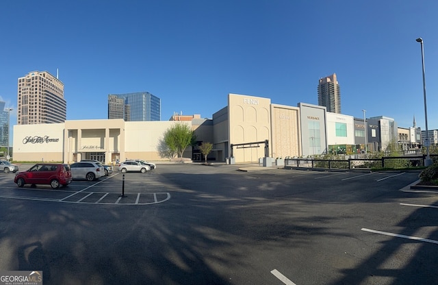 828 Canterbury Overlook NE, Atlanta, GA 30324 - uncovered parking lot with a view of city