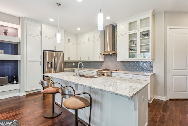 828 Canterbury Overlook NE, Atlanta, GA 30324 - kitchen featuring a sink, wall chimney exhaust hood, dark wood-style floors, stove, and a breakfast bar