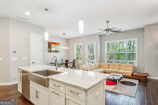 828 Canterbury Overlook NE, Atlanta, GA 30324 - kitchen with a sink, dark wood-style floors, baseboards, ceiling fan, and light stone counters