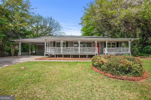 5052 Mountain St, Stone Mountain, GA 30083 - view of front of property with a front lawn, an attached carport, a porch, and concrete driveway