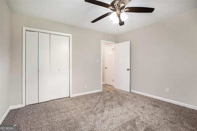 5052 Mountain St, Stone Mountain, GA 30083 - unfurnished bedroom featuring a ceiling fan, carpet floors, baseboards, and a closet