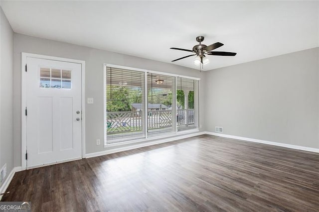 5052 Mountain St, Stone Mountain, GA 30083 - entrance foyer with baseboards, visible vents, ceiling fan, and wood finished floors