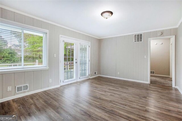 5052 Mountain St, Stone Mountain, GA 30083 - spare room featuring baseboards, visible vents, crown molding, and wood finished floors