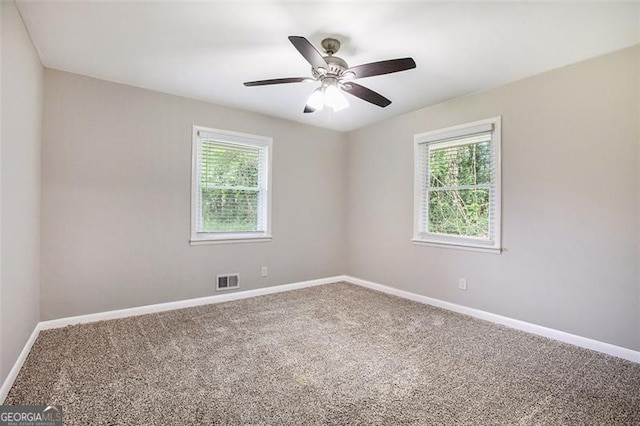 5052 Mountain St, Stone Mountain, GA 30083 - unfurnished room with visible vents, a healthy amount of sunlight, and carpet