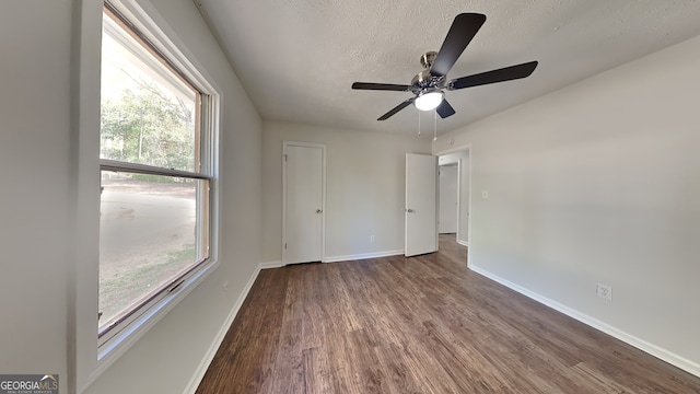 130 Fairview Dr, Stockbridge, GA 30281 - unfurnished bedroom featuring wood finished floors, a textured ceiling, and a ceiling fan