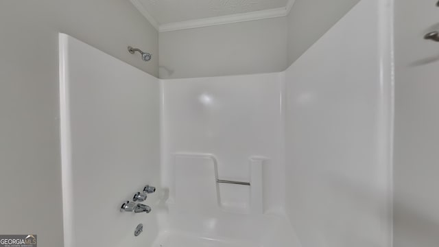 130 Fairview Dr, Stockbridge, GA 30281 - bathroom with crown molding and shower / bathtub combination