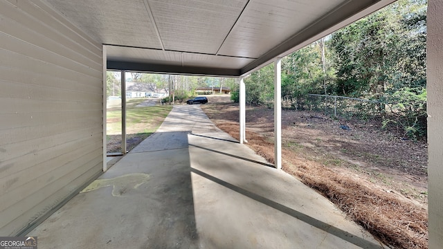 130 Fairview Dr, Stockbridge, GA 30281 - view of patio / terrace featuring an attached carport and fence