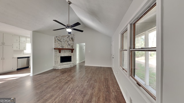 130 Fairview Dr, Stockbridge, GA 30281 - unfurnished living room featuring dark wood-style flooring, a healthy amount of sunlight, lofted ceiling, and ceiling fan