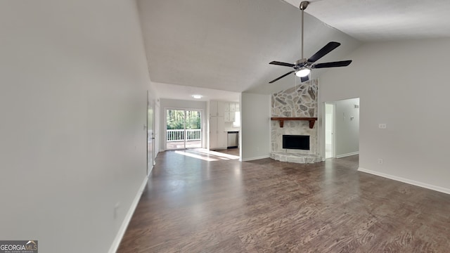 130 Fairview Dr, Stockbridge, GA 30281 - unfurnished living room with a stone fireplace, baseboards, ceiling fan, and wood finished floors