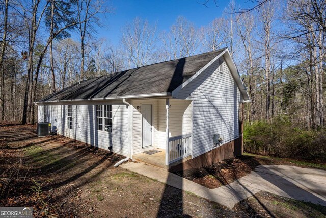 694 Austin Rd, Newnan, GA 30263 - view of property exterior featuring a cooling unit and roof with shingles