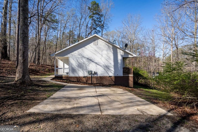 694 Austin Rd, Newnan, GA 30263 - view of side of home featuring crawl space and a porch