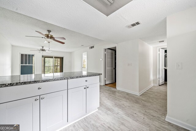66 Fair Haven Way SE, Smyrna, GA 30080 - foyer entrance with a textured ceiling, baseboards, and light wood finished floors