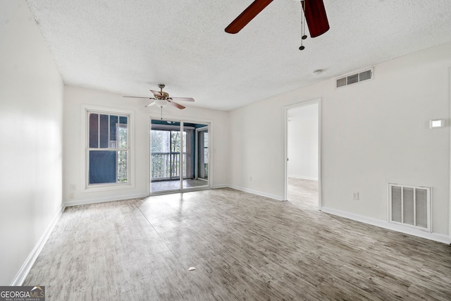 66 Fair Haven Way SE, Smyrna, GA 30080 - unfurnished bedroom featuring access to exterior, visible vents, wood finished floors, baseboards, and connected bathroom