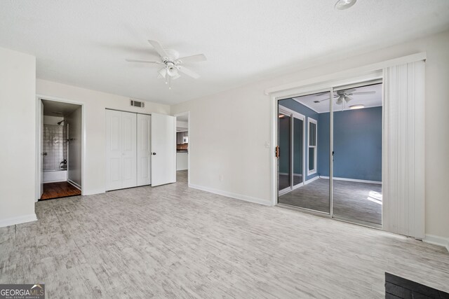 66 Fair Haven Way SE, Smyrna, GA 30080 - unfurnished bedroom featuring access to exterior, visible vents, wood finished floors, baseboards, and connected bathroom