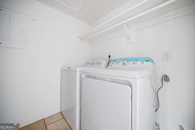 66 Fair Haven Way SE, Smyrna, GA 30080 - clothes washing area with laundry area, washer and clothes dryer, light tile patterned floors, and electric panel