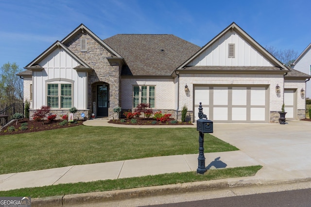432 Horizon Trl, Canton, GA 30114 - view of front of home with board and batten siding, a garage, a front yard, concrete driveway, and stone siding