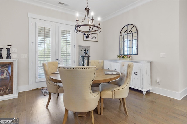 432 Horizon Trl, Canton, GA 30114 - dining space with a chandelier, ornamental molding, wood finished floors, and baseboards