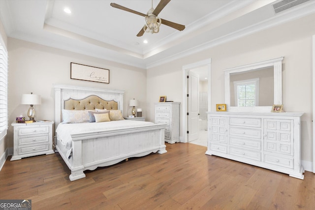 432 Horizon Trl, Canton, GA 30114 - bedroom with wood finished floors, a raised ceiling, recessed lighting, crown molding, and connected bathroom