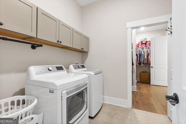 432 Horizon Trl, Canton, GA 30114 - laundry room with cabinet space, washing machine and dryer, light tile patterned floors, and baseboards