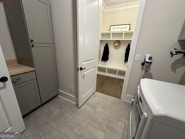 432 Horizon Trl, Canton, GA 30114 - laundry area with separate washer and dryer, cabinet space, light tile patterned flooring, baseboards, and ornamental molding