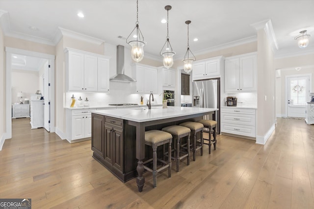 432 Horizon Trl, Canton, GA 30114 - kitchen featuring wall chimney range hood, stainless steel fridge, white cabinets, a breakfast bar, and crown molding
