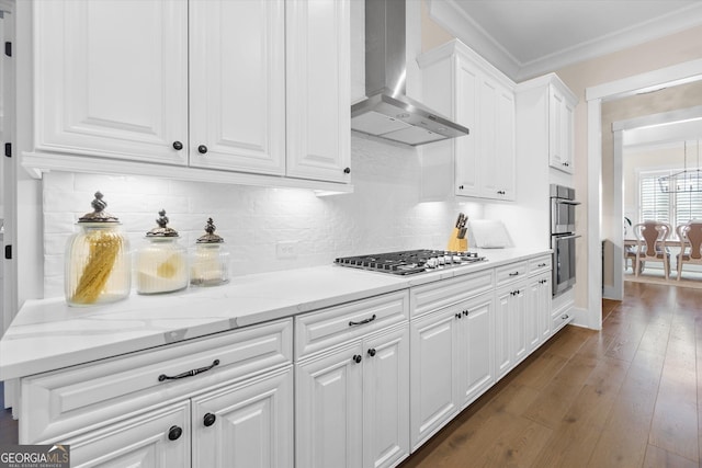 432 Horizon Trl, Canton, GA 30114 - kitchen featuring wall chimney range hood, stainless steel appliances, white cabinetry, ornamental molding, and dark wood-style flooring