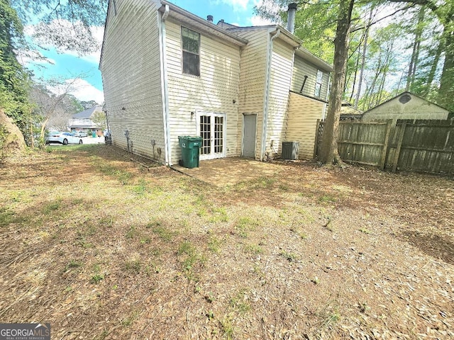 1557 Springleaf Ct SE, Smyrna, GA 30080 - rear view of property with fence and cooling unit