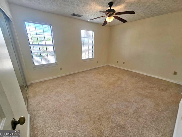 1557 Springleaf Ct SE, Smyrna, GA 30080 - unfurnished room featuring a textured ceiling, visible vents, and a healthy amount of sunlight
